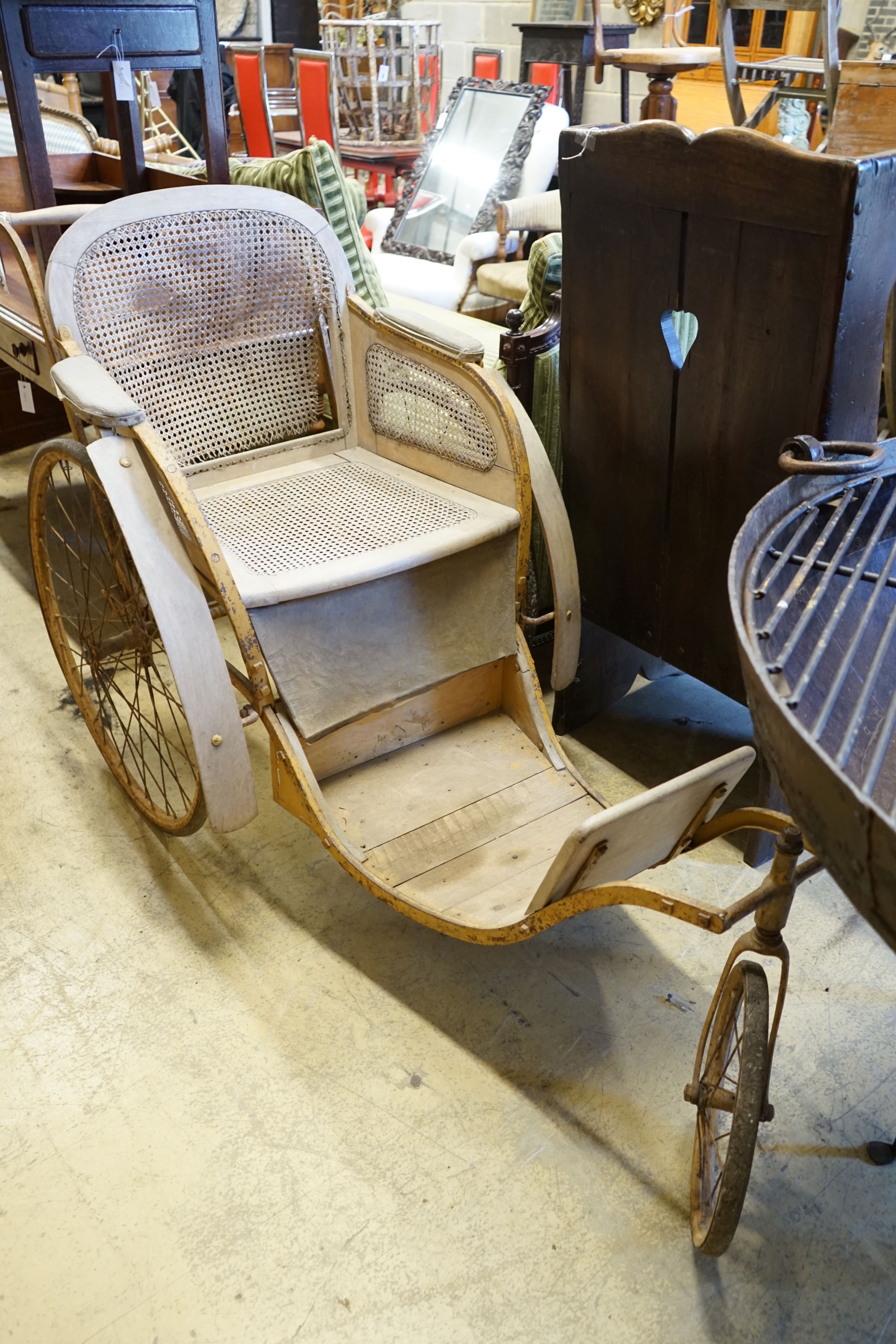 A late Victorian caned invalid chair